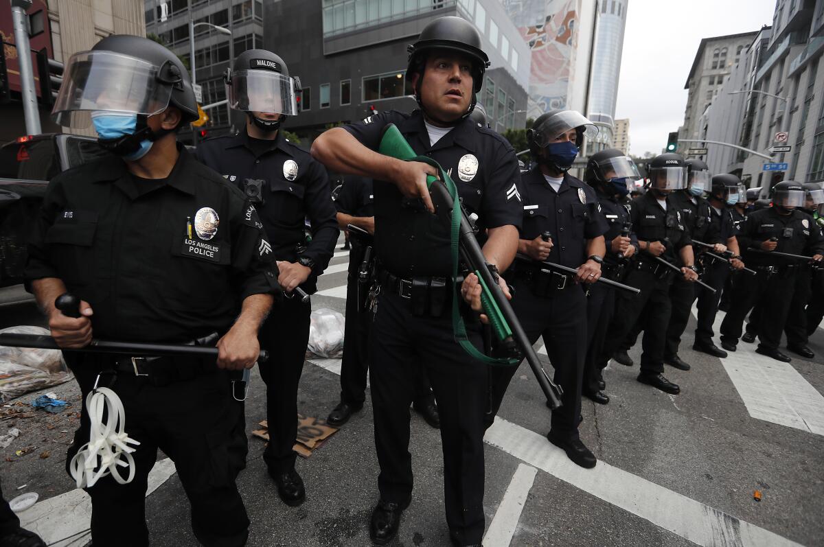 LAPD officers form a human barrier