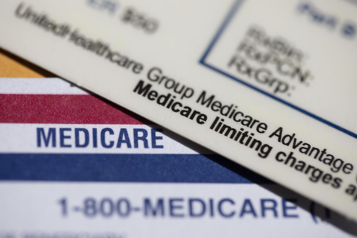A close-up of a UnitedHealthcare insurance card resting on a Medicare card