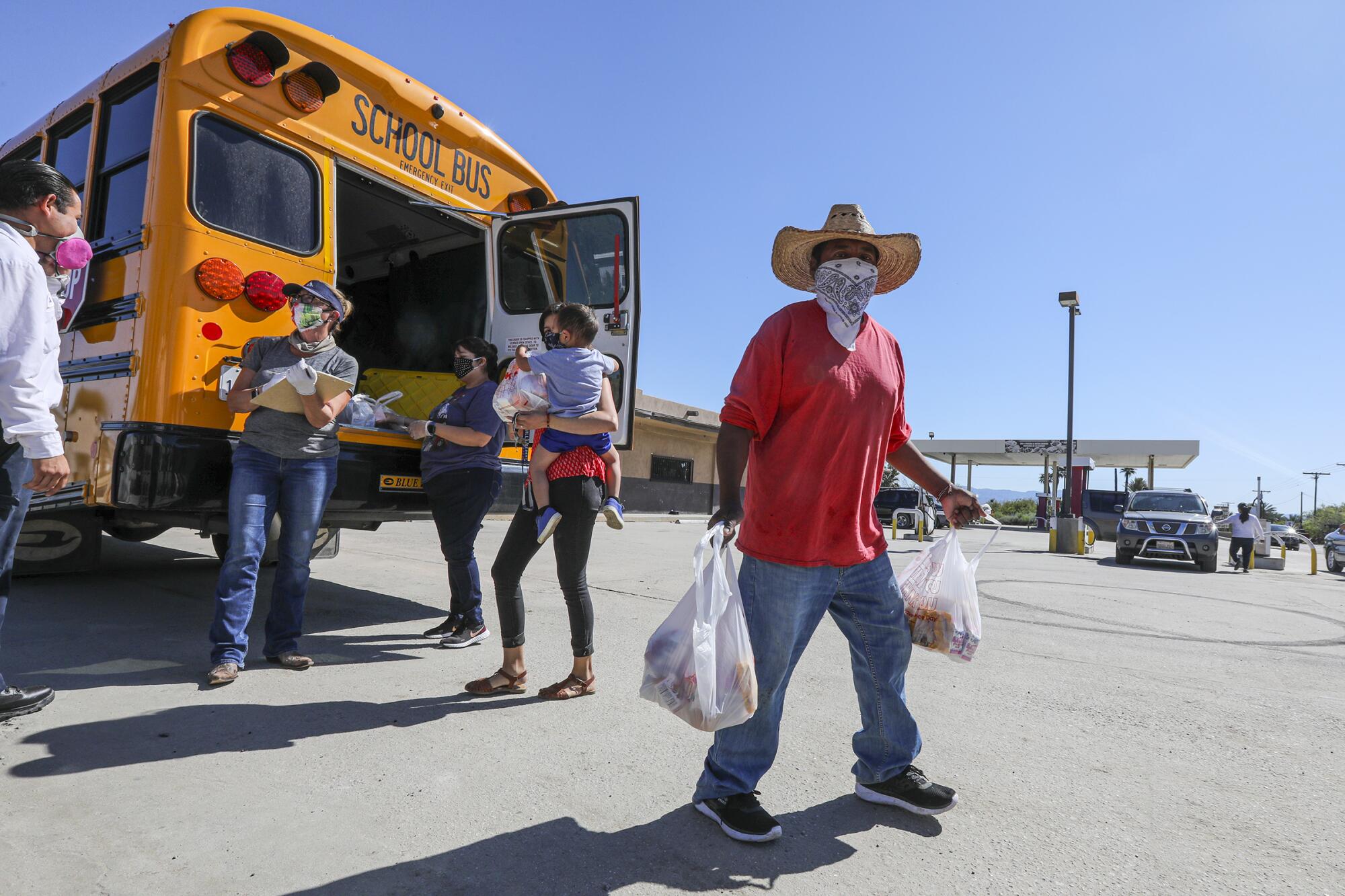 Coachella Valley Unified School District delivers meals in front of Oasis Mobile Home Park in Thermal
