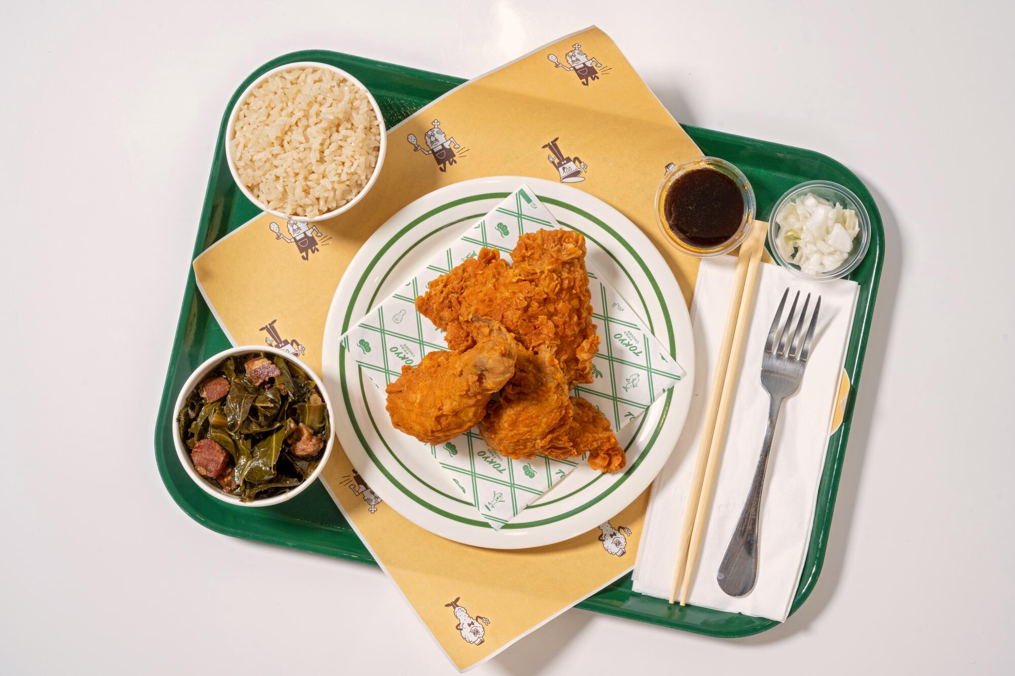 A three-piece chicken plate with sides of rice and collard greens at Tokyo Fried Chicken in downtown Los Angeles.