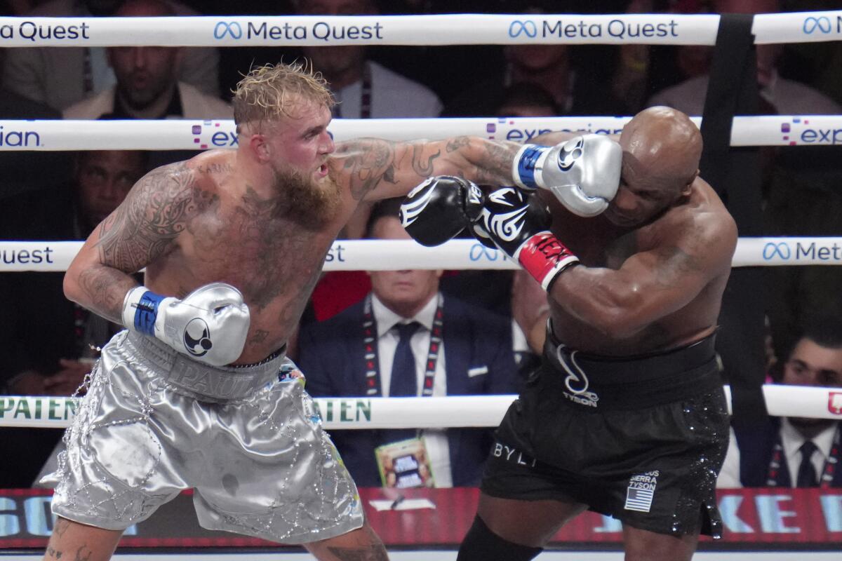 Jake Paul lands a left to Mike Tyson during their heavyweight boxing match Nov. 15 in Arlington, Texas.