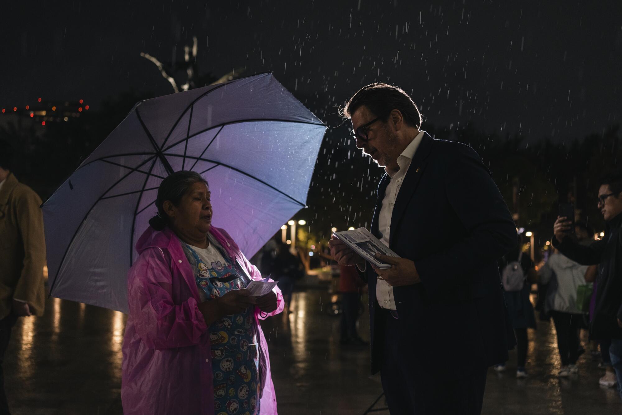A candidate for Supreme Court Justice talks to a citizen during a campaign event