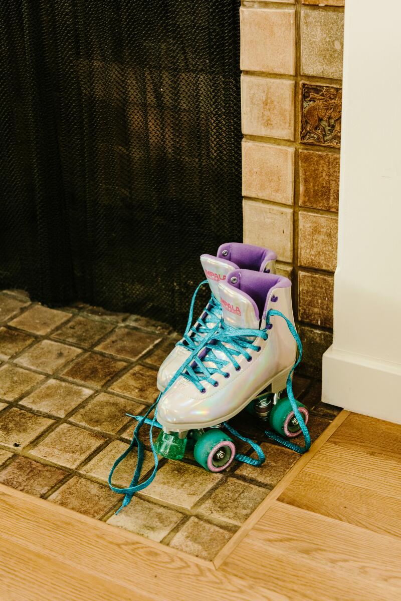 Roller skates on a tile fireplace hearth
