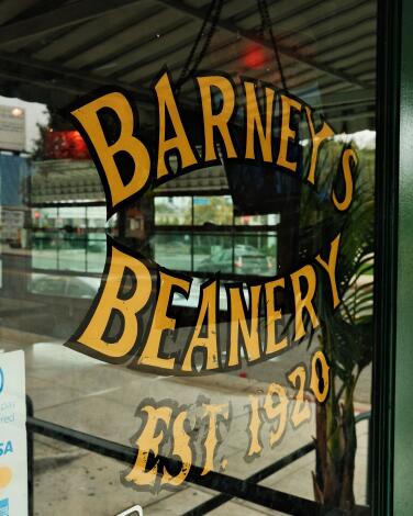 An exterior door of Barney's Beanery in West Hollywood that reads: "Barney's Beanert, EST. 1920"