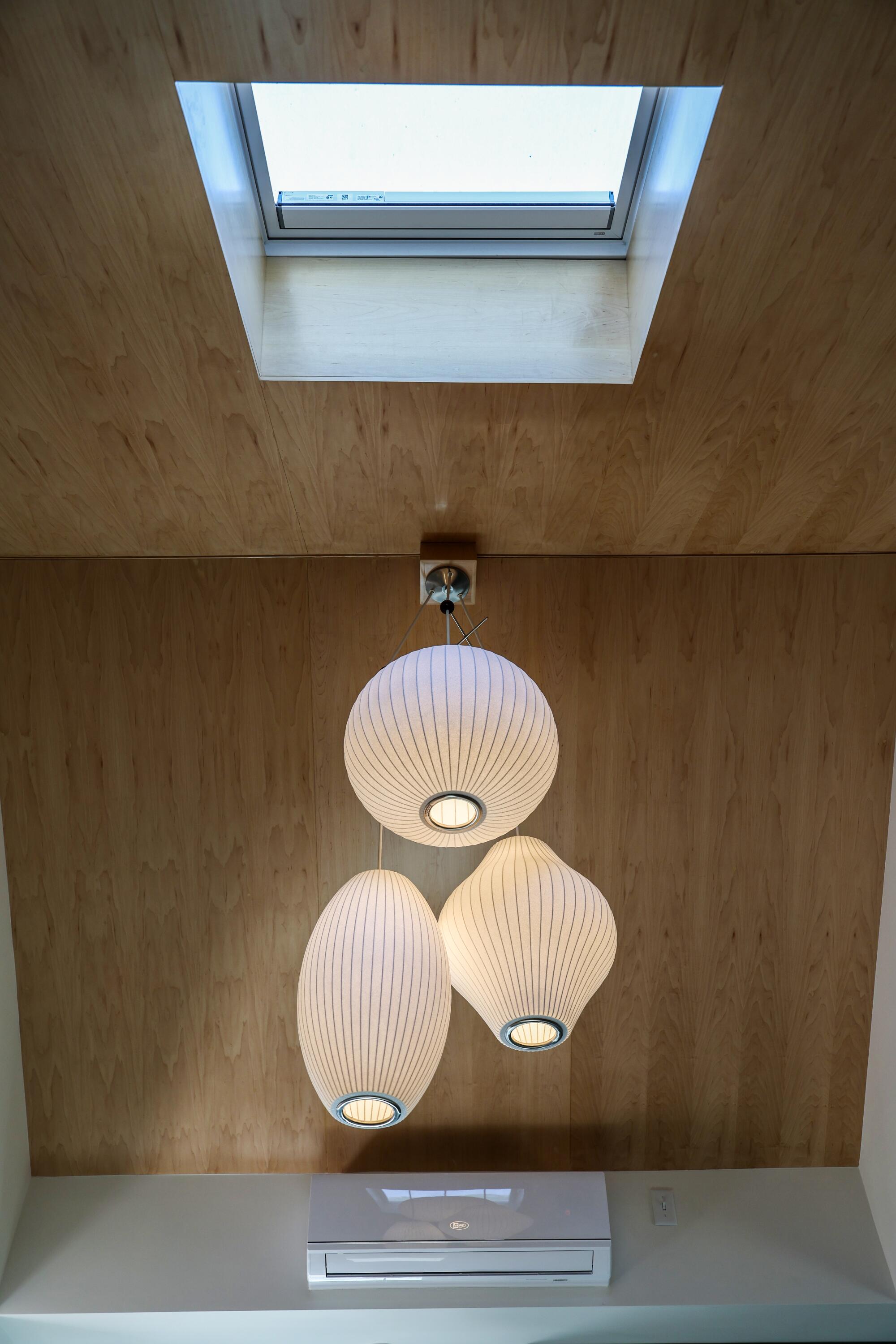A triple Nelson bubble lamp hangs from the ceiling of the ADU.