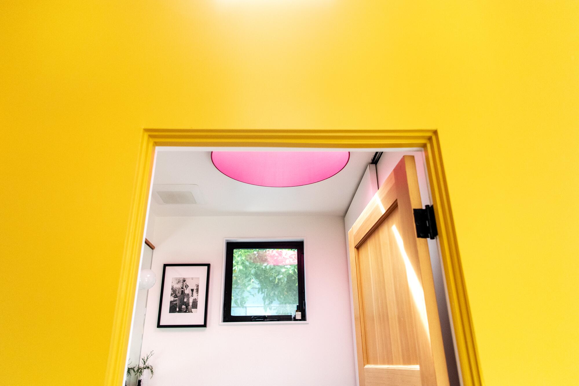 A red skylight in a bathroom
