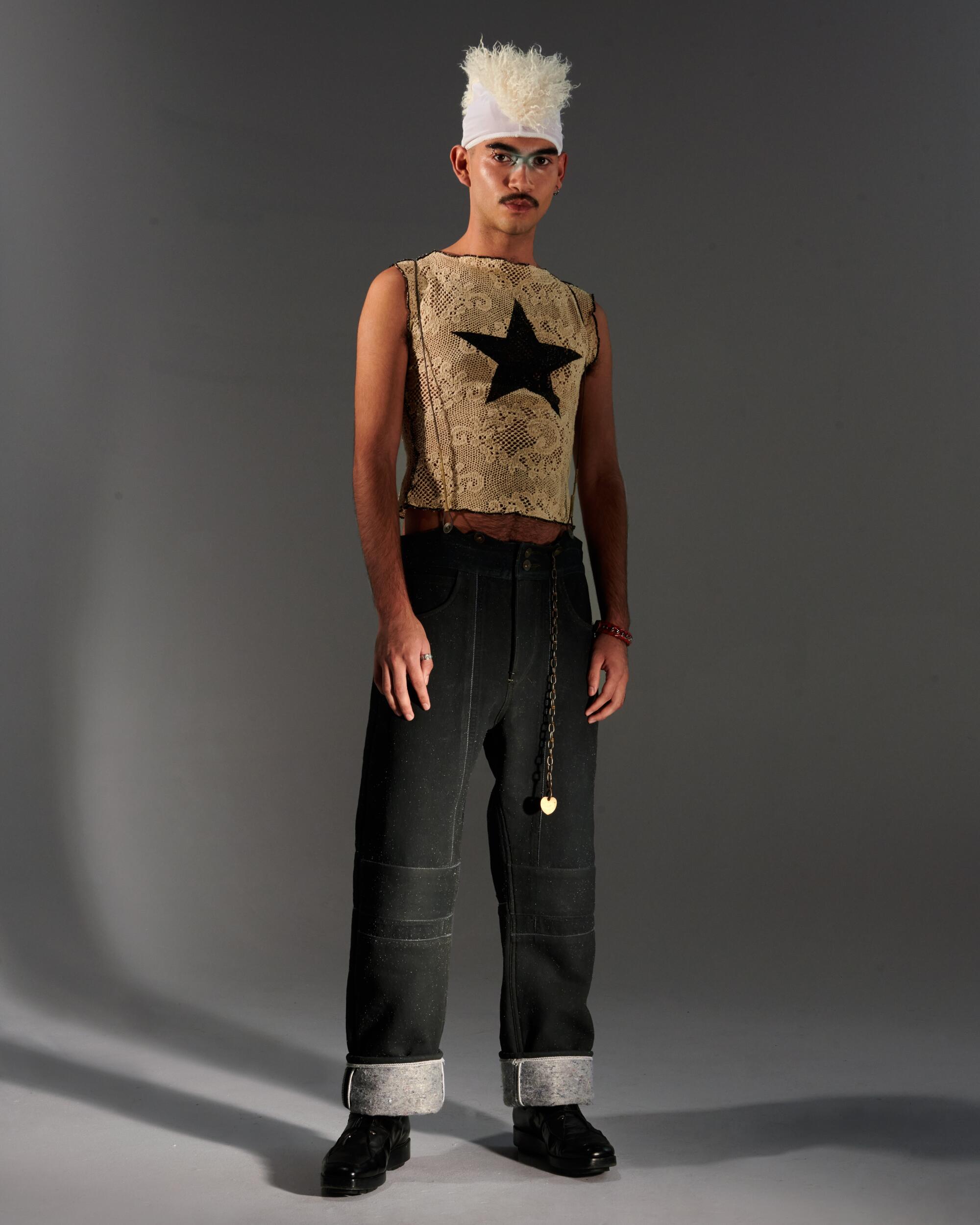 Jester wears Hood Baby top, Object From Nothing bottoms, Vaquera hat, Kiko Kostadinov shoes, Zucca bracelet.