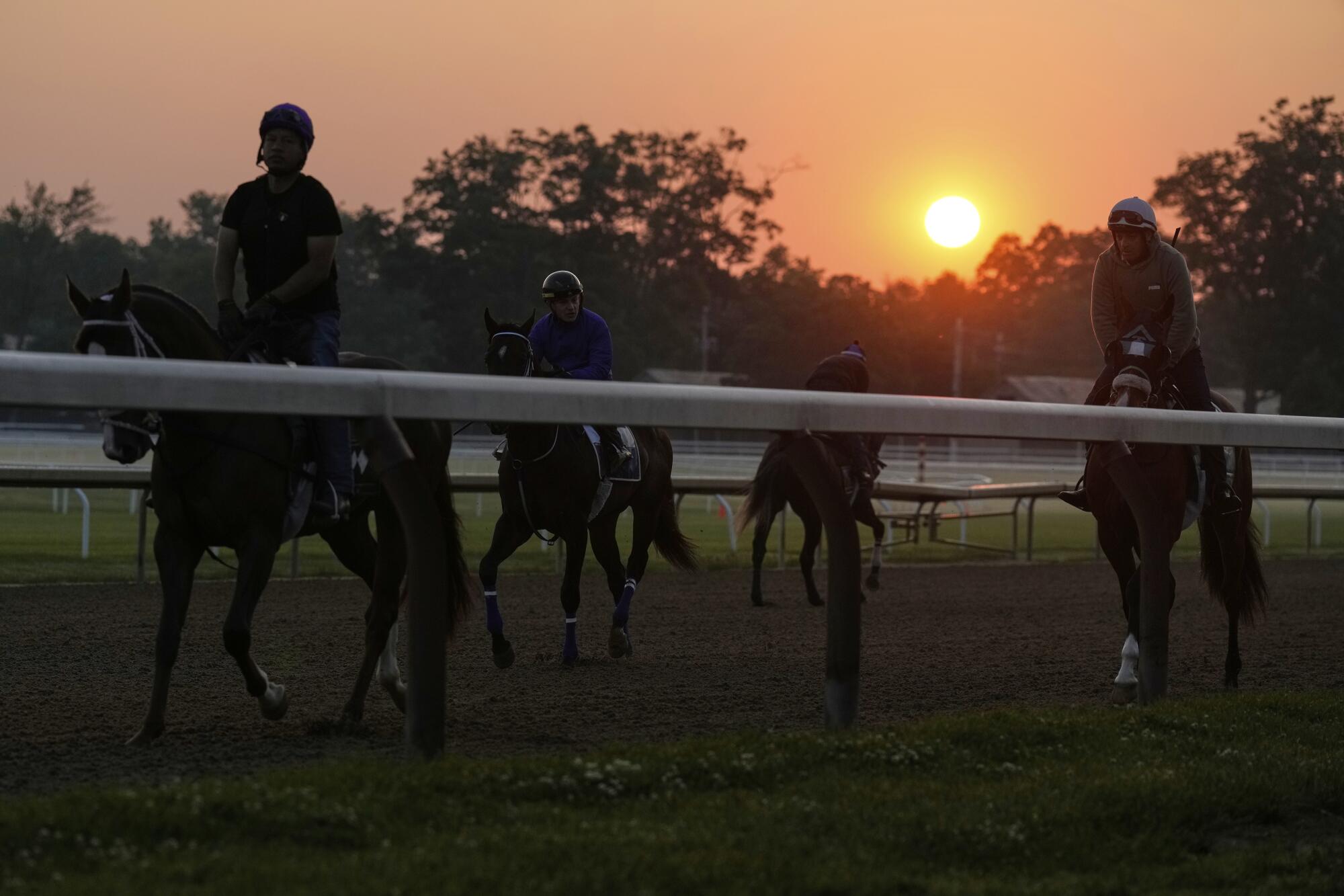 The sun rises over Saratoga Race Course on Friday.