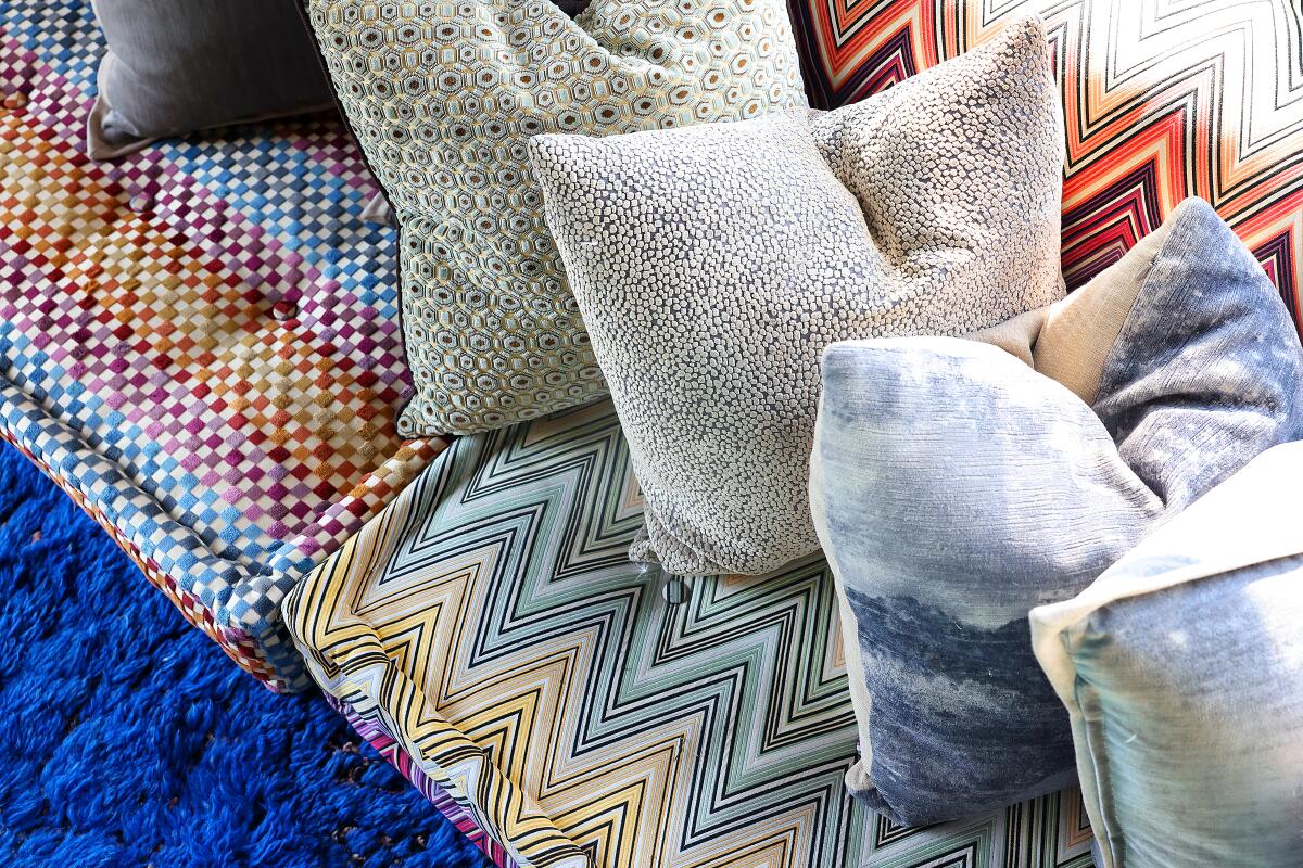 Pillows on colorful couch cushions