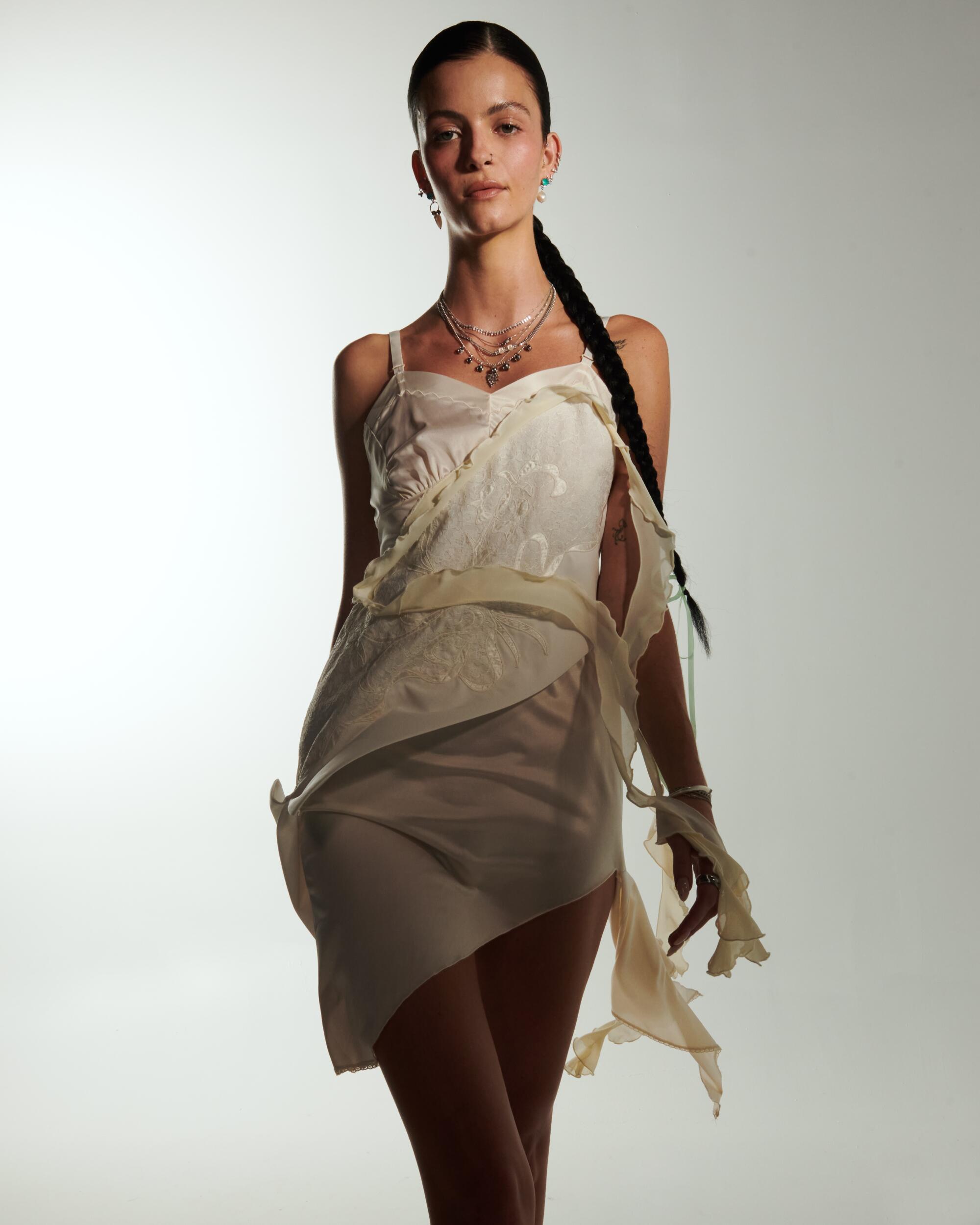 April wears Sentimiento dress, Givenchy shoes, Maria Tash earrings, jewelry by Spinelli Kilcollin, Emma Walton,