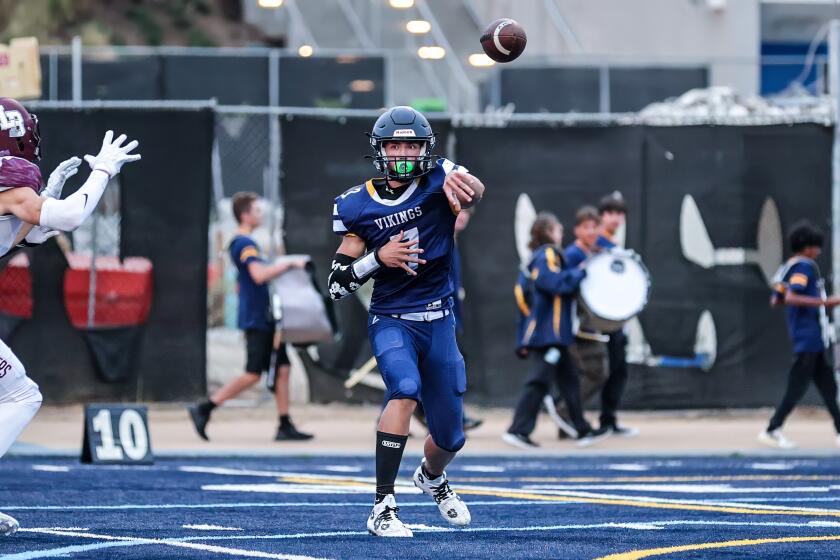 Quarter Wyatt Brown of Santa Monica throwing against Laguna Beach.