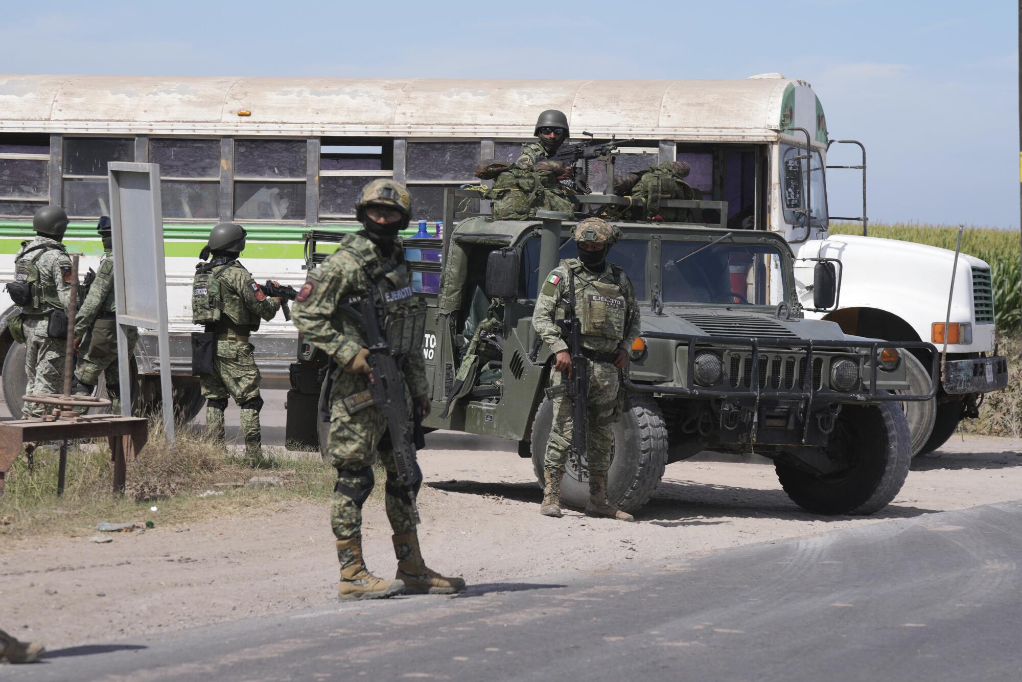 Soldiers patrol a highway in Villa Juarez, outside of Culiacan, Sinaloa.