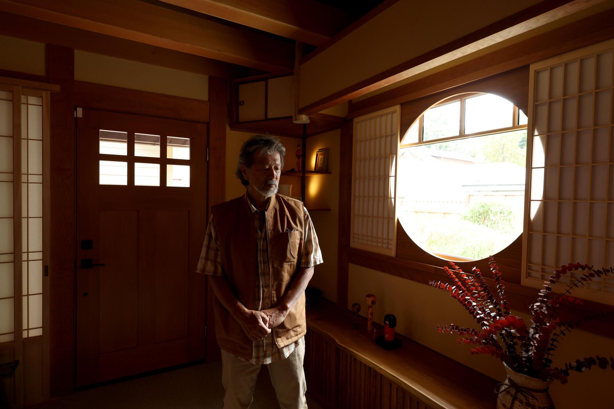 Japanese American carpenter Toshi Kawabata stands inside Lizabeth Altounian's ADU.