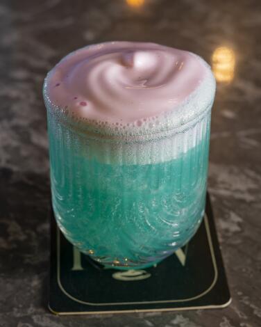 The "It's Giving Lisa Frank" cocktail at Holy Water bar.